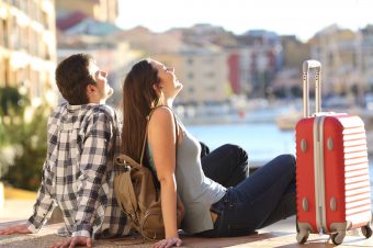 Side,View,Of,A,Couple,Of,2,Tourists,With,A